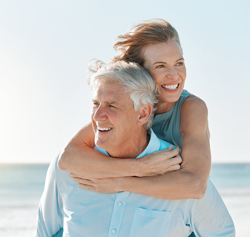 happy mature couple in the beach